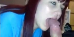 redhead girl sucking a massive cock