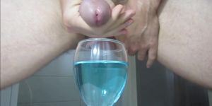 Ejaculating creamy cumshot into a cup of water 2