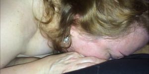 Sucking on her hubby's cock