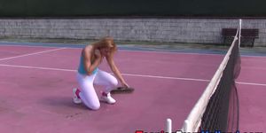 Teen rubs on tennis court