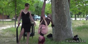 Redhead slave hanged on public tree