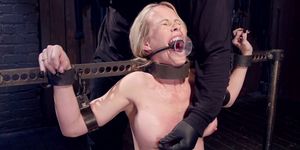Gagged Milf in metal stock gets whipped (Simone Sonay)