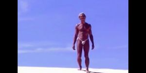 Tanned guy on beach in tiny string thong temporarily