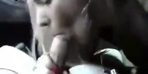 Teen blonde gives a blowjob in a car