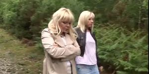 Two blonde MILFs suck off stranger in forest