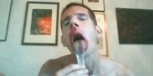 Faggot feeding on a condom full of stinky old cum