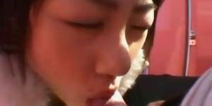 japanese girl is sucking his cock in public until he cu