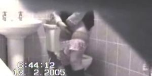 Woman masturbating in the toilet