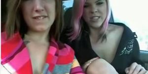 lesbians inside car in parking lot