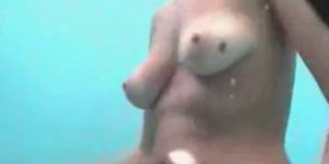 Cute shaved chick takes a shower on hidden cam