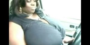 Big black tits topless in car