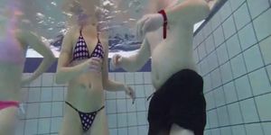 Dirty girls jerk my cock in the middle of the pool