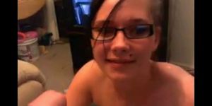 Cute girl in nerdy glasses blows a cock