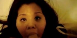 Asian slut sucks and receives cum on her face