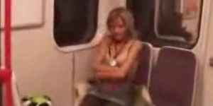 Sexy blonde strips and masturbates in public train