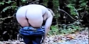 Mature Nude Female Undresses in Woods