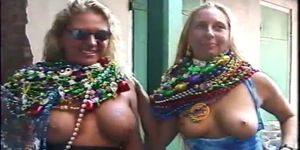 two girls showing their all at mardi gras