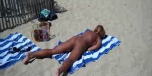 My hot bitch rubbing pussy at nude beach. Public nudity