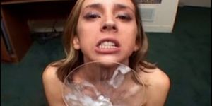 Girl collects thick cum in a glass