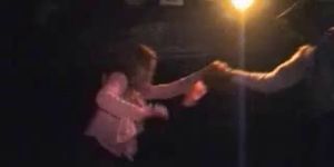 male dancer strips woman on stage