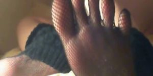 Perfect toes and soles with black nails and fishnet toe
