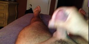 Stroking cock and cumshot