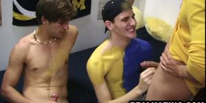 Frat boy hunk sucks and tugs on a pair of cocks