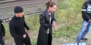 Angie blows a penis by the train track