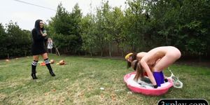 Slender teens playing around in the backyard for money