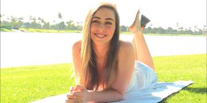 Sweet hottie Lacey teasing trimmed cunt at a picnic