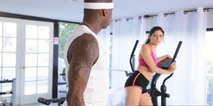 Sexy babe fucked by a black gym trainer