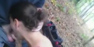 Brunette babe blowjob in the forest