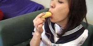 Innocent teen Asian sucks a banana and a loaded pecker