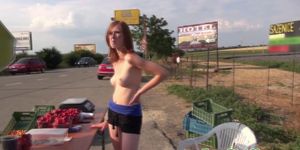 European redhead shows her perky tits at a driving car