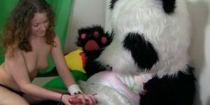 Titted brunette to have sex with huge toy panda