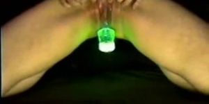 hot chick masturbating with a glowing object in her pus
