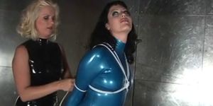 Slut in blue latex suit gagged and bound