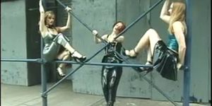 Three chicks in latex pleasure each other in public
