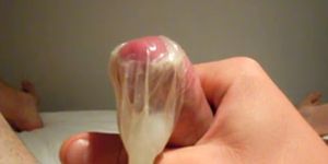 huge load into a condom in slow-mo