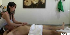 Asian masseuse toying with cock of her lucky customer