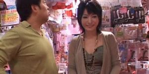 Japanese stunner gets hairy twat vibed in a sex shop