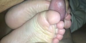 Wife uses her sexy feet to make my cock cum