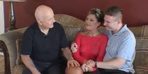 Husband watches feisty blonde wife take cock on a couch