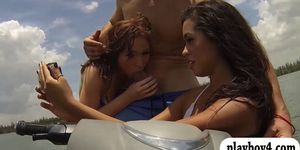 Two sexy bikini girls enjoy foursome scene on speedboat
