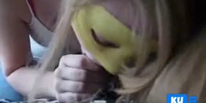 Teen with party mask sucking his black cock