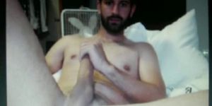 bearded dude shows his massive hung cock on cam