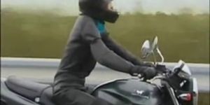 Girl Riding a Motorcycle with dildo plugged in