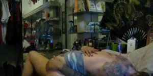 Tattooed and pierced couple fucking inside of tattoo sh
