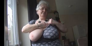Granny with huge boobs teasing and stripping