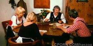 Farm old man pleases younger blondie on his dining tabl